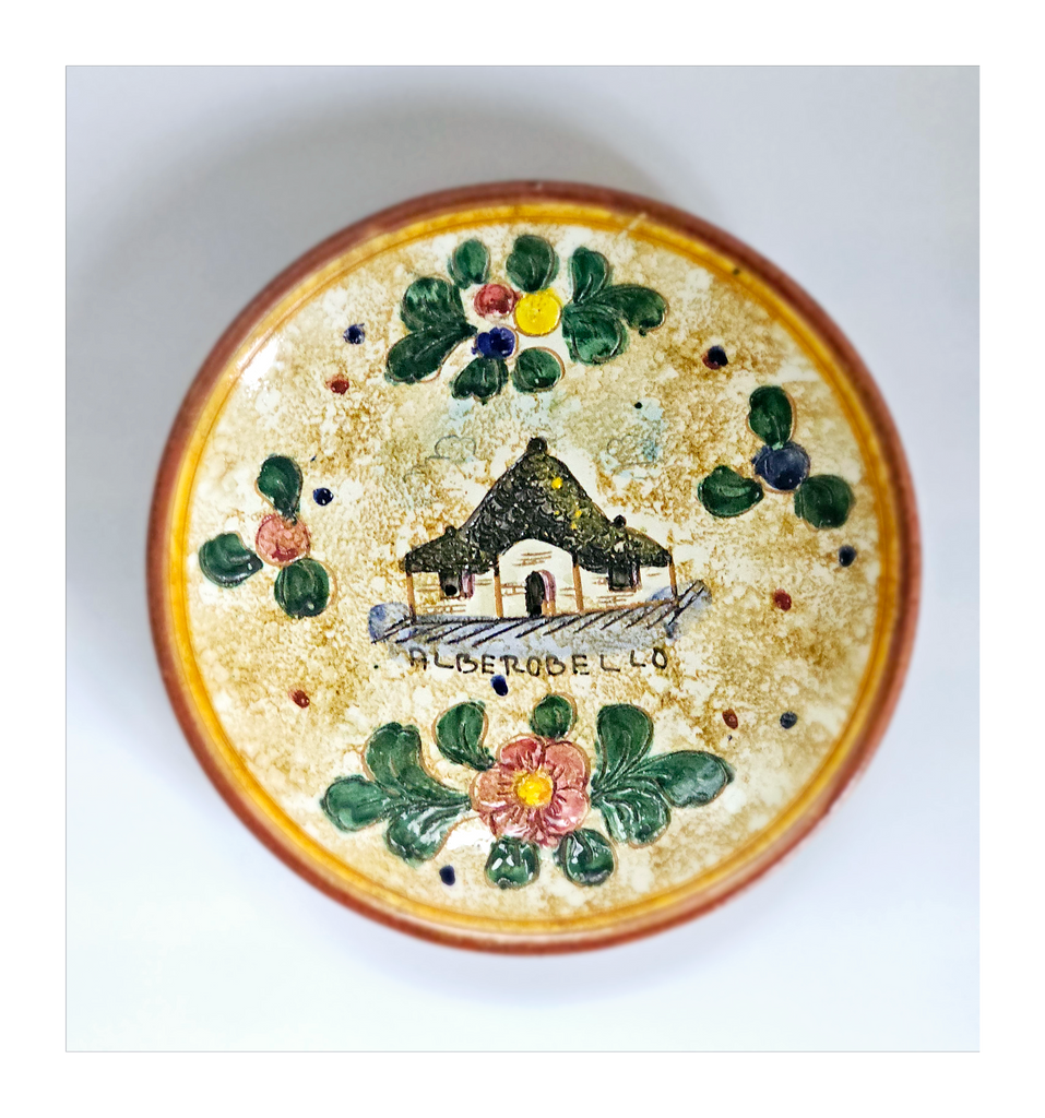 Vintage Hand Made Glazed Ceramic Souvenir Wall Plate Embossed with a Trulli House from Alberobello, Italy