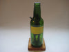 Vintage quirky fun bottle with figurine of a Scottish Bagpipe player (Angus MacFlasher) in front of the bottle