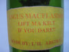 Vintage quirky fun bottle with figurine of a Scottish Bagpipe player (Angus MacFlasher) in front of the bottle