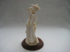Handcrafted Vittorio Tessaro Boy Figurine in Capodimonte on a wooden stand