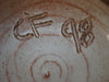 Contemporary Design Ceramic Bowl in yellow with blue and green pattens all around, signed by the artist as CF 98