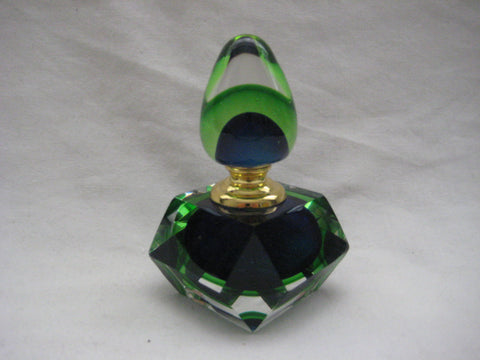 French Crystal perfume bottle in shades of blue, green, and clear colours