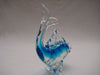 Murano style glass dolphine figurine in clear glass and translucent blue.