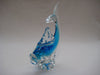 Murano style glass dolphine figurine in clear glass and translucent blue.