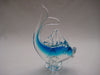 Murano style glass dolphine figurine in clear glass and translucent blue.