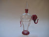 Perfume bottle in clear and maroon colour glass with gold trimmings in the shape of an elephant