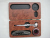 Wooden box containing wine accessories