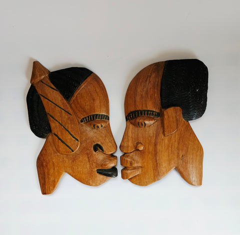 A Pair of Rare Vintage African Hand Carved Wall Hanging Wooden Sculptures, Featuring Faces of a Man and a Woman Facing Each Other