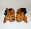 A Pair of Rare Vintage African Hand Carved Wall Hanging Wooden Sculptures, Featuring Faces of a Man and a Woman Facing Each Other
