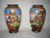 A pair of hand painted Japanese ceramic vases