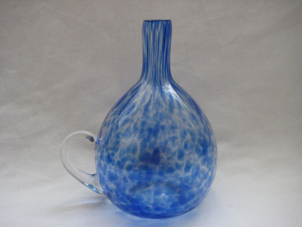 Bottle with a handle in clear glass with streaks of blue