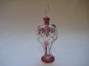 Perfume bottle in clear and maroon colour glass with gold trimmings in the shape of an elephant