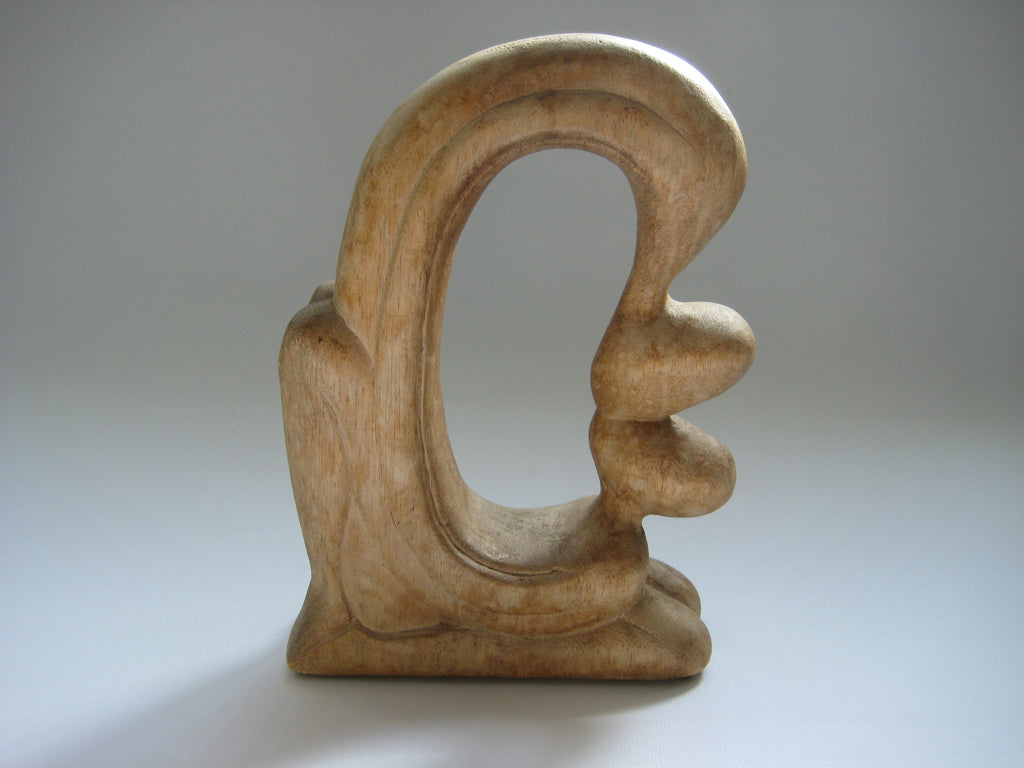 A Contemporary Style Wooden Scultpture of a Man and a Woman Kissing