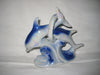 Ceramic figurine of two dolphins