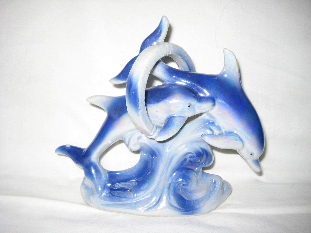 Ceramic figurine of two dolphins